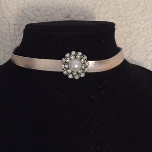 Gold leather choker.